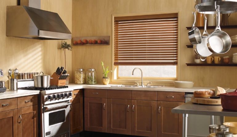 Gainesville kitchen faux wood blinds.